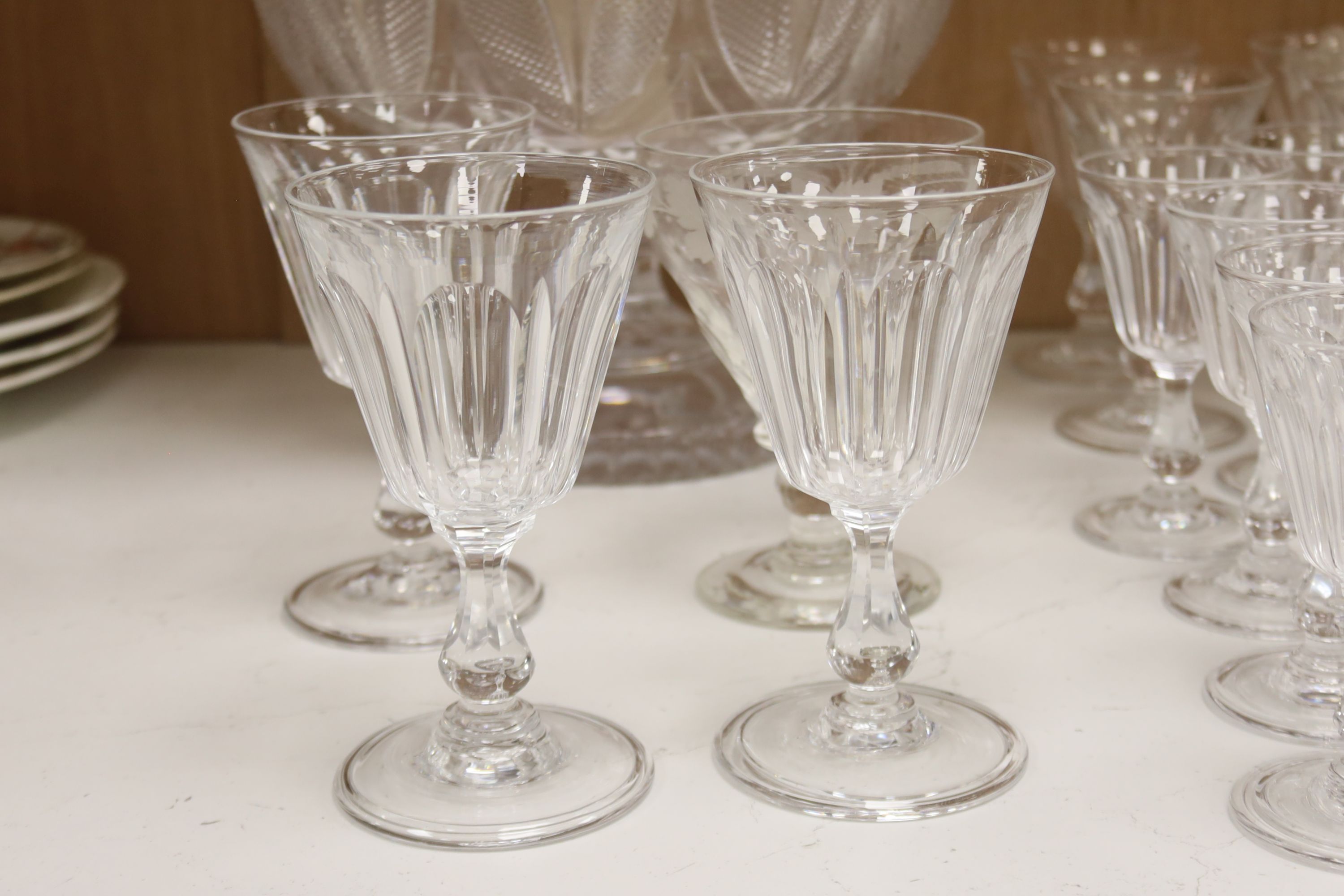 A cut glass punch bowl and a collection of table glassware, to include a late Victorian silver mounted decanter (lacking stopper)